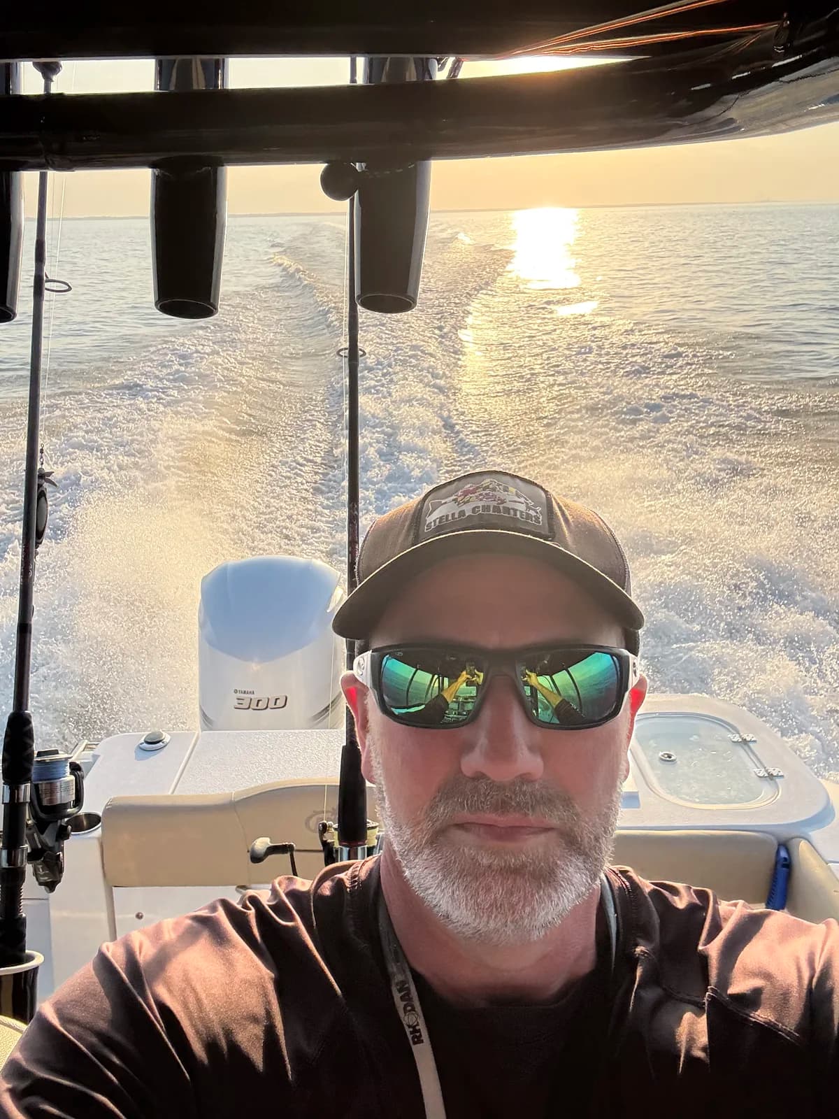 Captain Eric Goodrich at the helm during a sunset cruise on the Chesapeake Bay